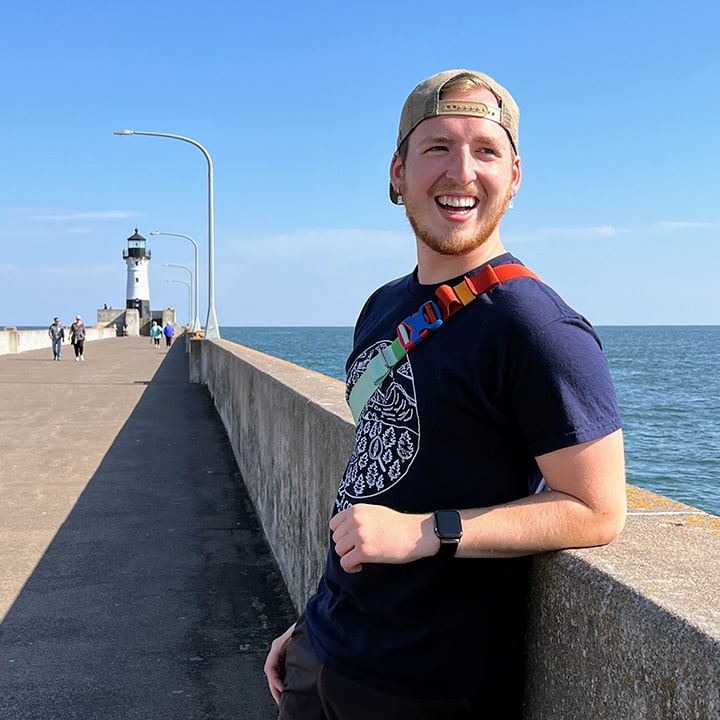 Alex Horgan standing on a pier