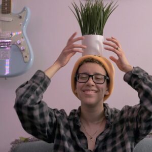Erin Minor with a plant hitting on her head